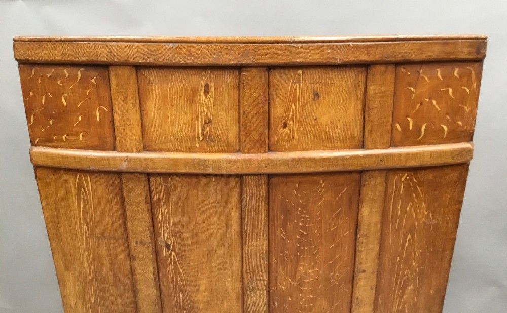 An antique Georgian high-backed wooden settle featuring a curved panelled back with a warm brown scumbled painted finish and integrated seat. View XX