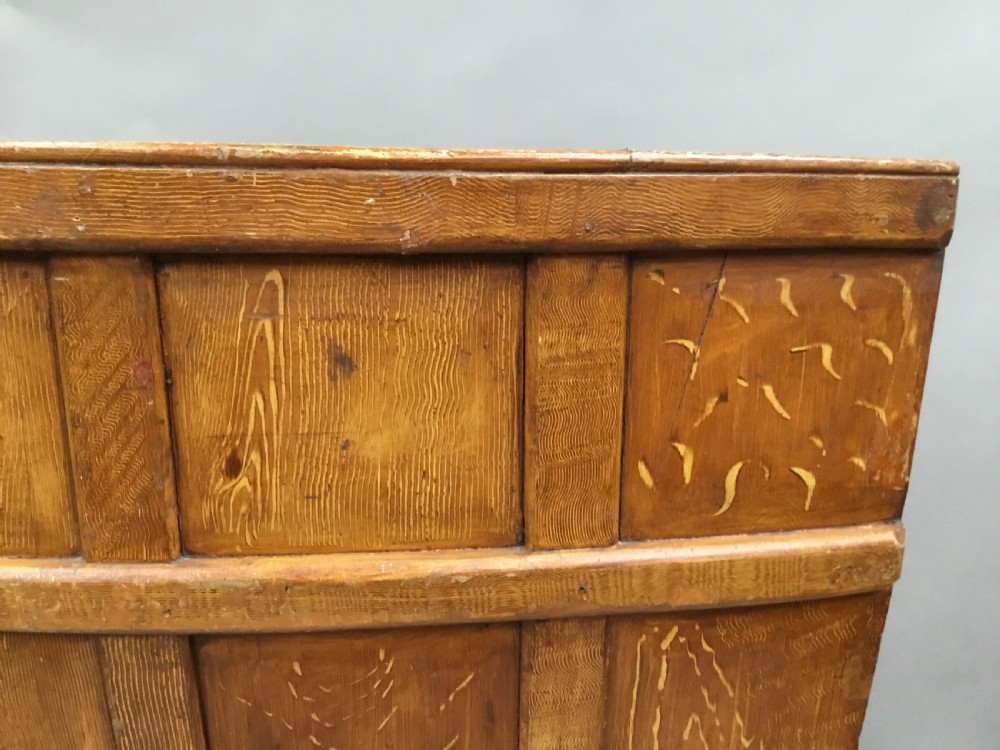 An antique Georgian high-backed wooden settle featuring a curved panelled back with a warm brown scumbled painted finish and integrated seat. View XXI