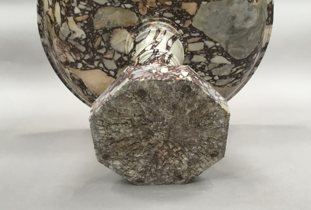 A large 19th-century Neoclassical tazza carved from variegated brecciated marble featuring a shallow wide bowl on a turned stem and octagonal base. View XXII