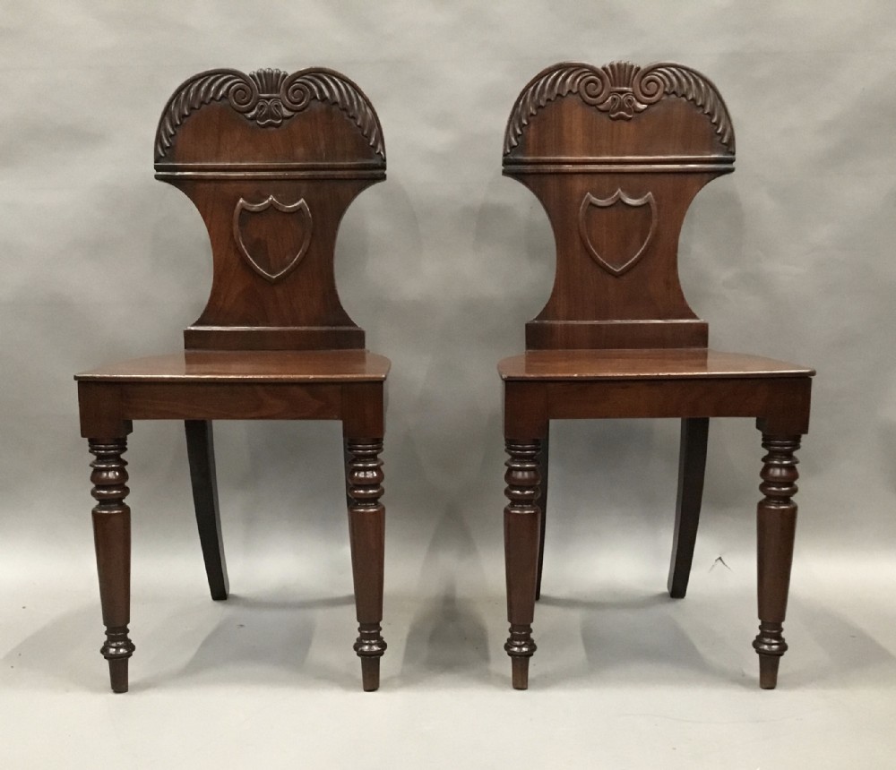 Regency pair of mahogany hall chairs