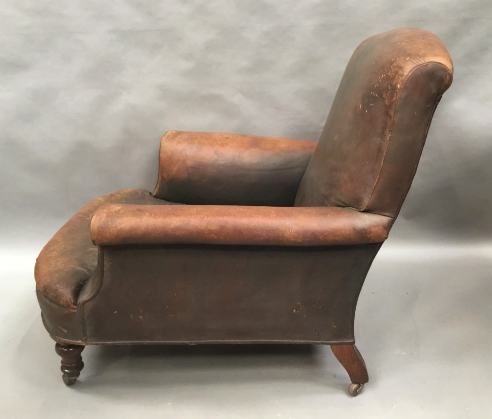  C19th large upholstered armchair in original leather of the Howard style View V