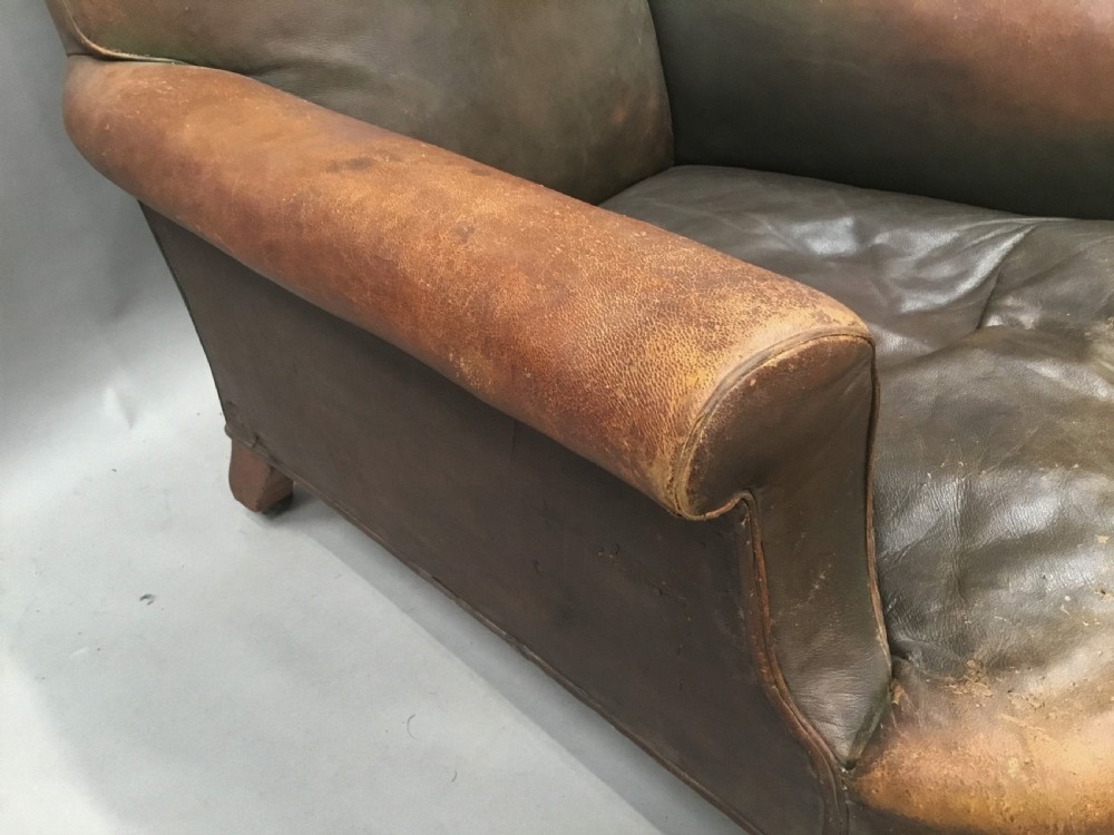  C19th large upholstered armchair in original leather of the Howard style View XV