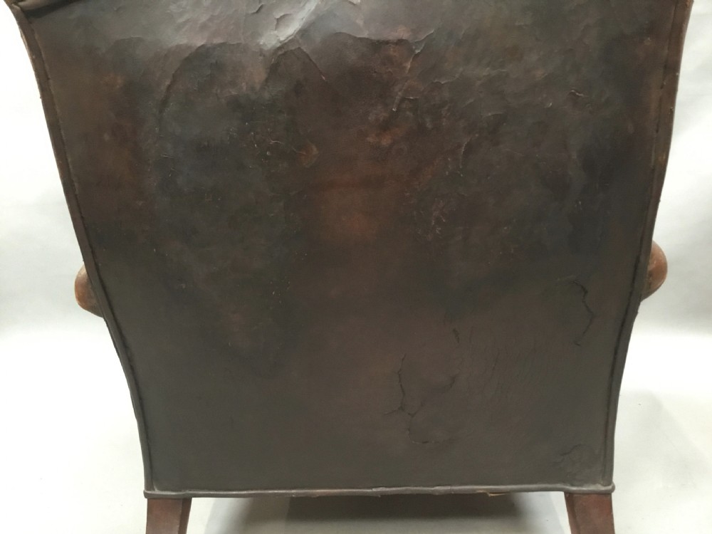  C19th large upholstered armchair in original leather of the Howard style View XVI