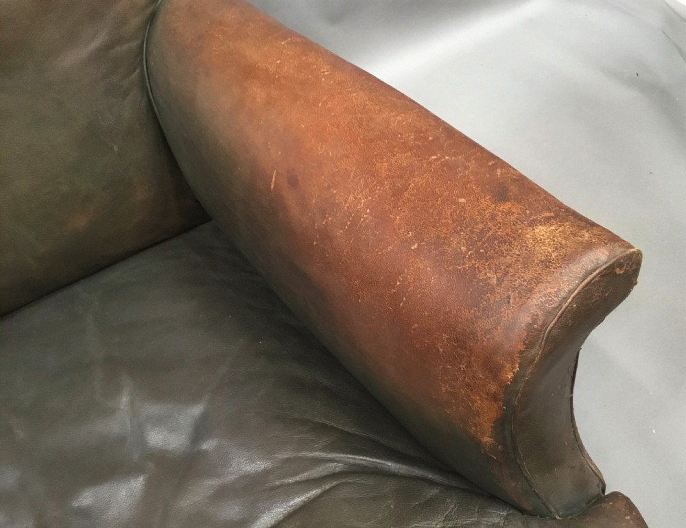 C19th large upholstered armchair in original leather of the Howard style View XVIII