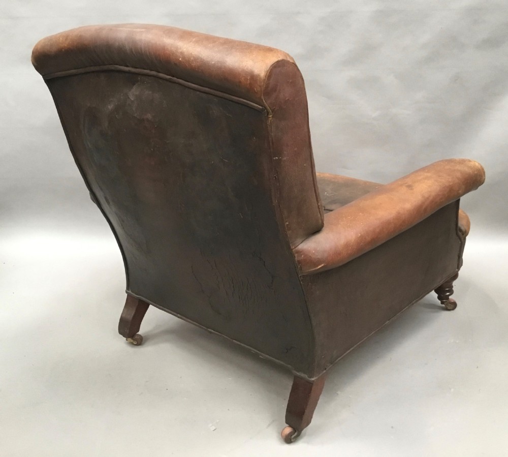  C19th large upholstered armchair in original leather of the Howard style View XX