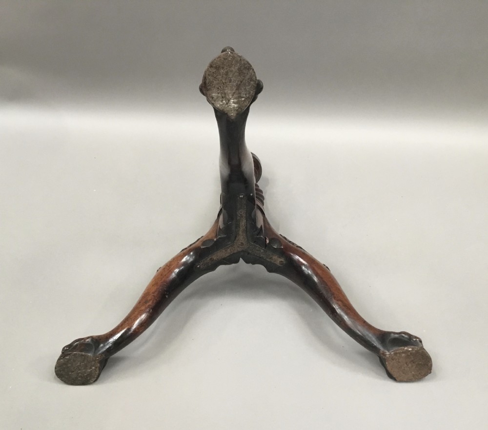 A mahogany George III style tripod table featuring a scalloped piecrust top, turned pedestal column, and cabriole legs with carved feet. View XXII
