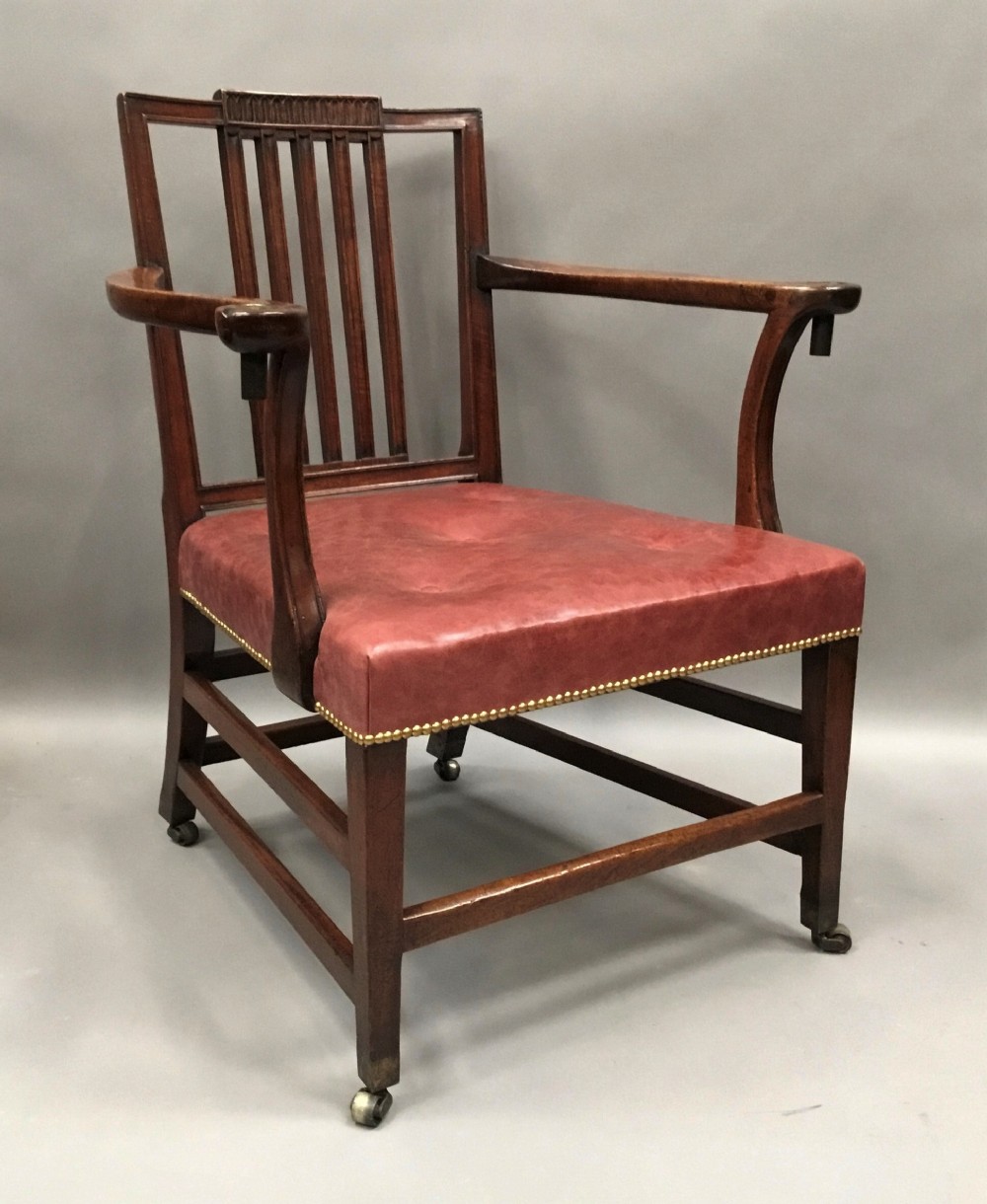George III mahogany library open armchair; of generous proportions 