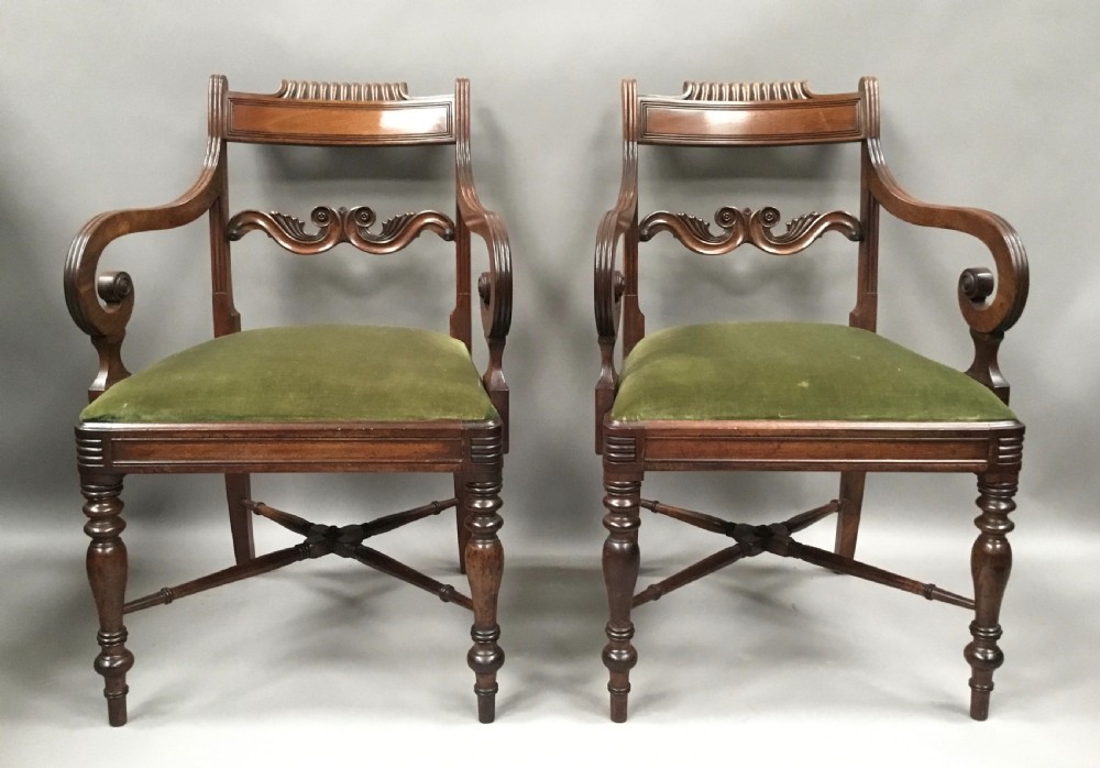 A pair of Regency mahogany open armchairs featuring scrolled armrests, turned front legs, and olive green velvet upholstered seats. View III