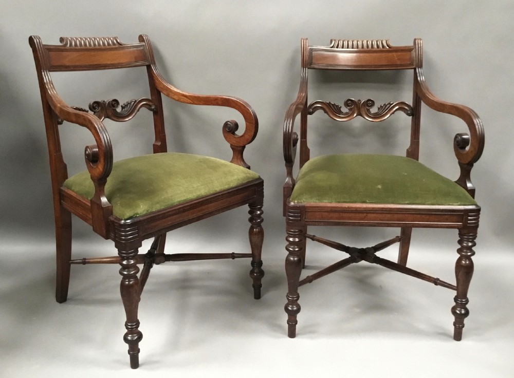 A pair of Regency mahogany open armchairs featuring scrolled armrests, turned front legs, and olive green velvet upholstered seats. View VIII