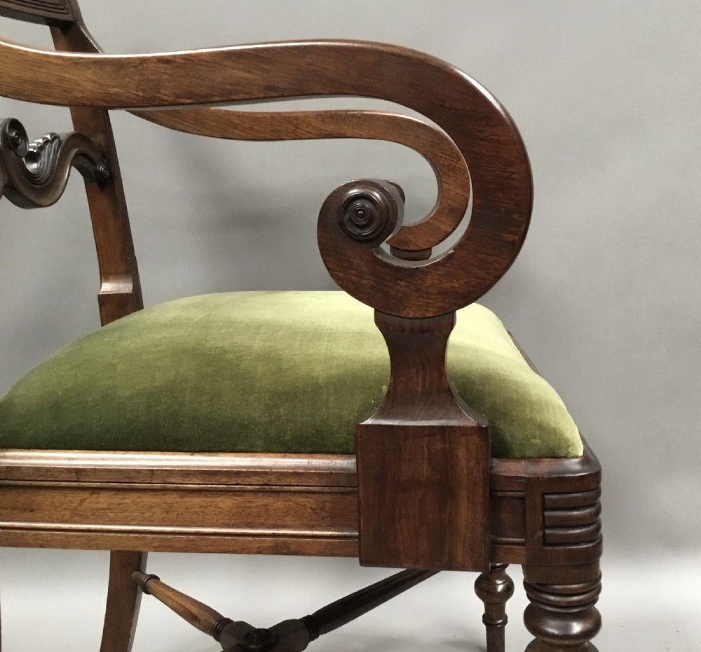 A pair of Regency mahogany open armchairs featuring scrolled armrests, turned front legs, and olive green velvet upholstered seats. View IX