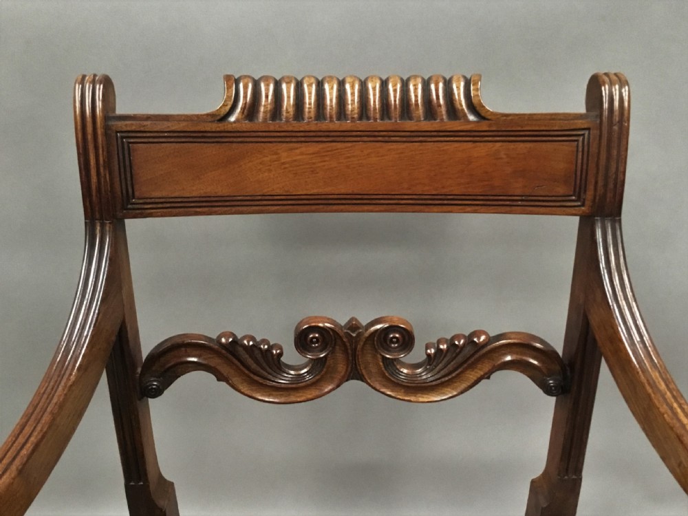 A pair of Regency mahogany open armchairs featuring scrolled armrests, turned front legs, and olive green velvet upholstered seats. View XI
