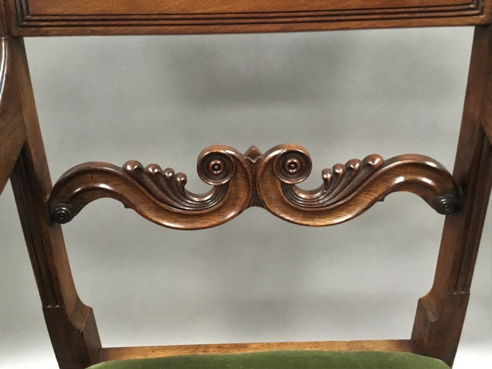 A pair of Regency mahogany open armchairs featuring scrolled armrests, turned front legs, and olive green velvet upholstered seats. View XII