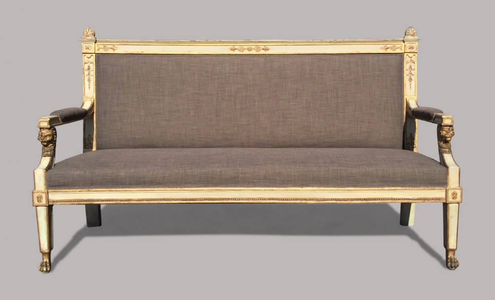 A 19th-century Italian Neoclassical cream painted and giltwood settee upholstered in neutral grey linen fabric. View II
