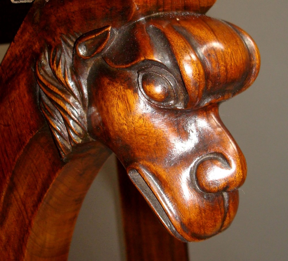 A pair of 19th-century Italian walnut console tables featuring carved zoomorphic legs, serpentine aprons with light string inlay, and lower curved stretchers. View VIII