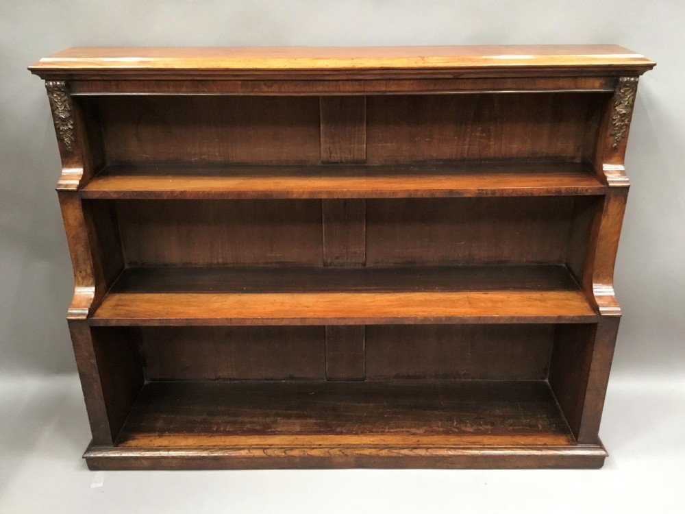 Mid C19th walnut waterfall open bookcase of neat proportions View XVI