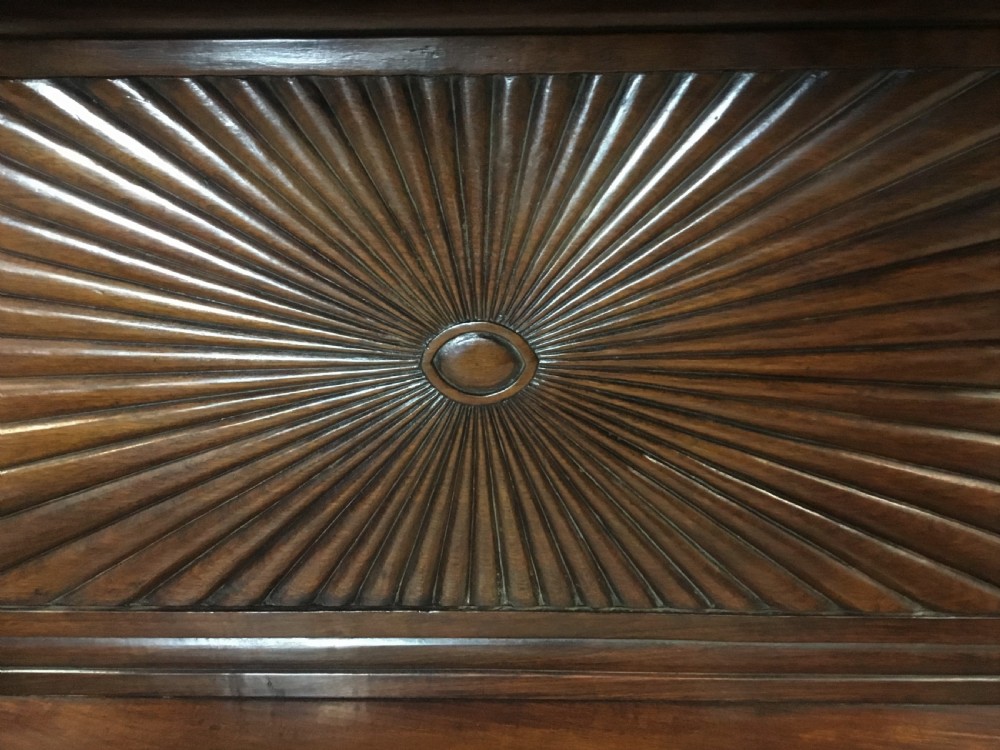 A 19th-century carved padouk console table featuring S-scroll legs, paw feet, a sunburst carved back panel, and a scrollwork gallery upstand. View XVII