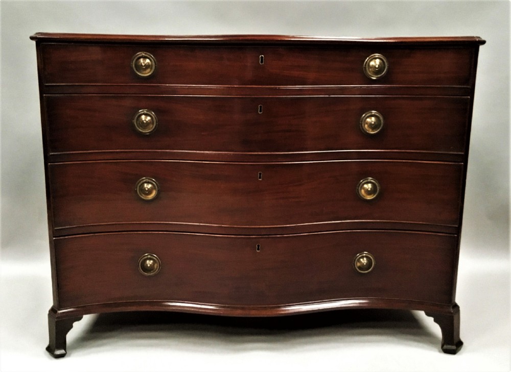 George III mahogany serpentine chest of drawers View II
