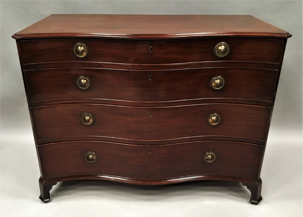 George III mahogany serpentine chest of drawers View III