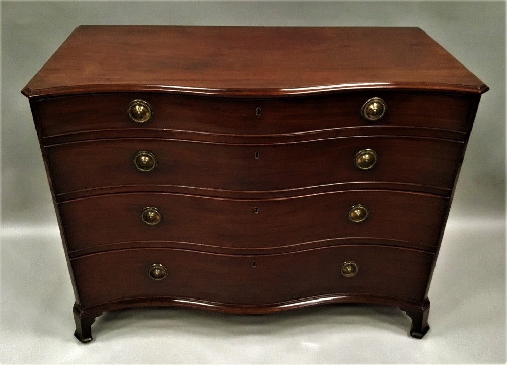 George III mahogany serpentine chest of drawers View X