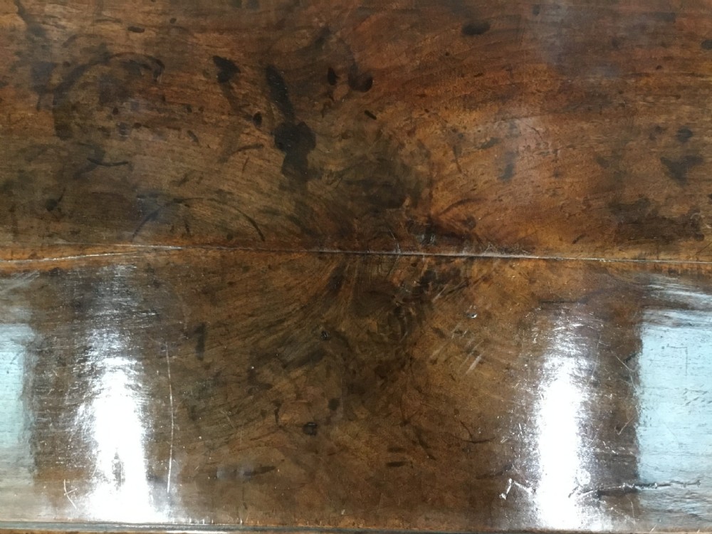 A George II dark walnut side table featuring carved shell knees on slender cabriole legs with pad feet and a single drawer with brass handles. View VI