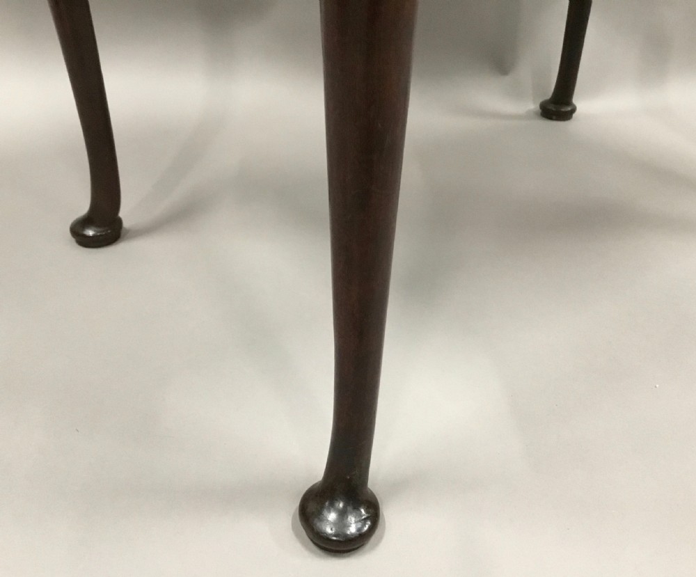 A George II dark walnut side table featuring carved shell knees on slender cabriole legs with pad feet and a single drawer with brass handles. View XVII