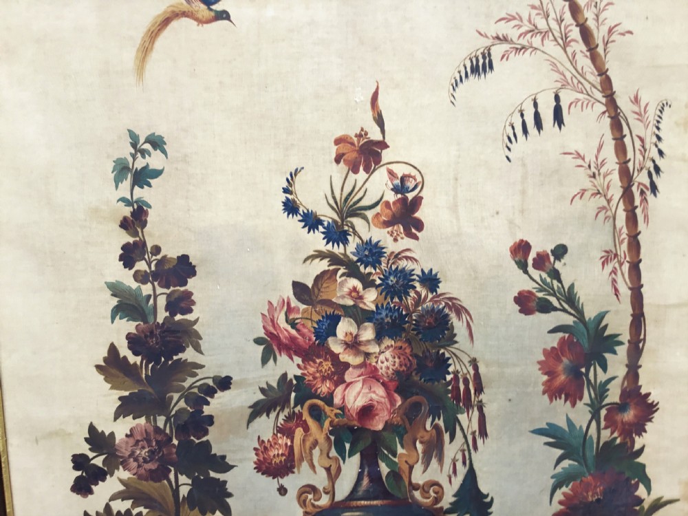A nineteenth-century oil painting on canvas depicting a floral arrangement in a classical urn, exotic birds, and a palm tree behind a stone balustrade, set within a dark wooden frame with a gold slip. View IX