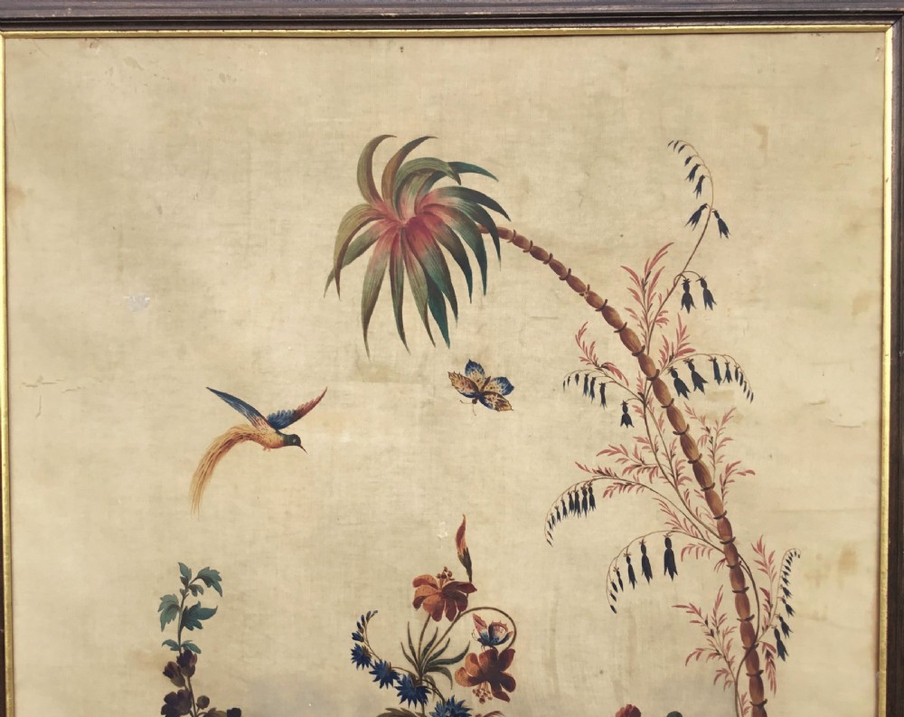 A nineteenth-century oil painting on canvas depicting a floral arrangement in a classical urn, exotic birds, and a palm tree behind a stone balustrade, set within a dark wooden frame with a gold slip. View X