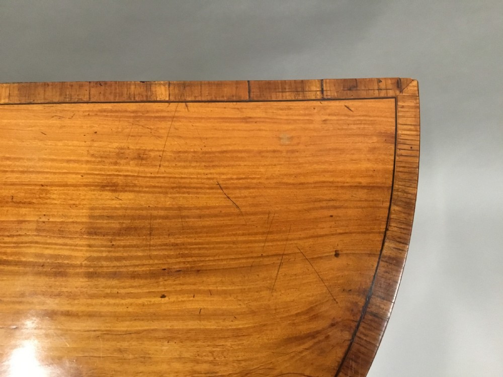 George III Satinwood demilune card table; in the Sheraton manner with an excellent colour View VII