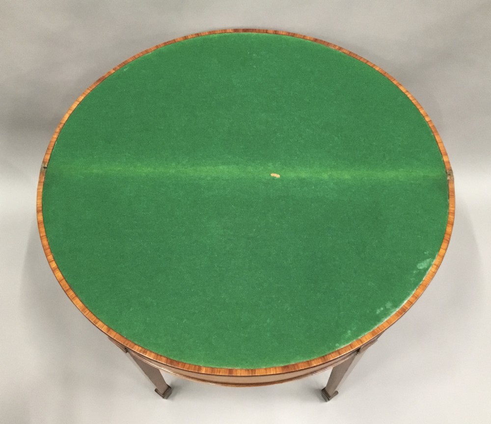 George III Satinwood demilune card table; in the Sheraton manner with an excellent colour View XII