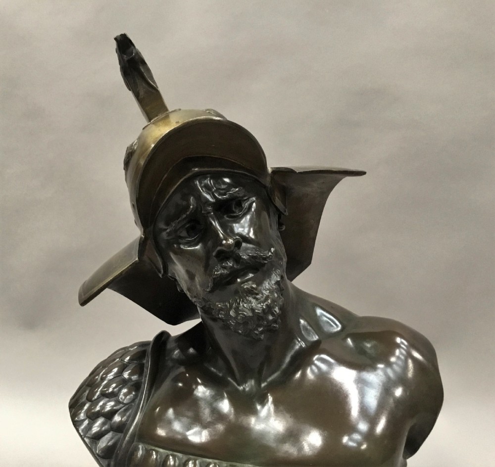 A 19th-century dark bronze bust depicting a helmeted Roman gladiator with a beard, mounted on a square variegated pink marble base. View III