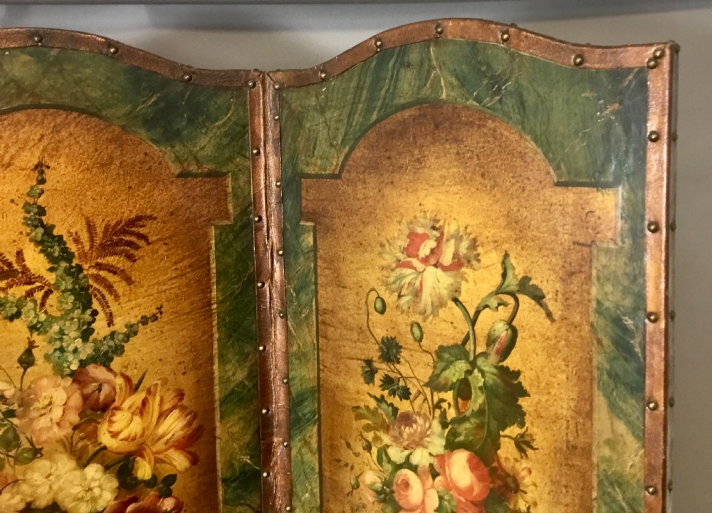 A 19th-century four-fold leather room divider screen featuring painted floral panels framed in faux-marble green borders with brass stud detailing. View IX