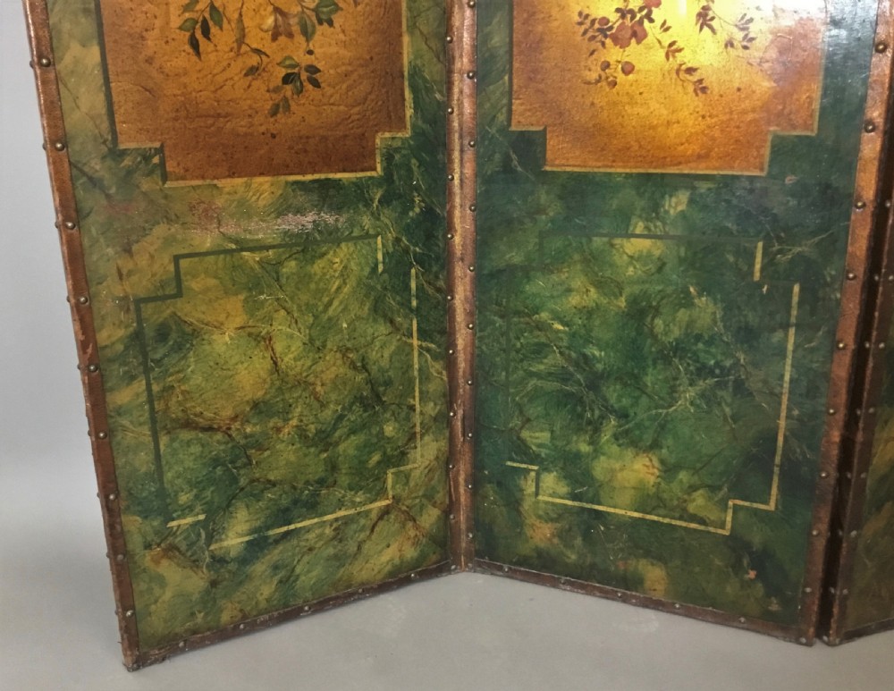 A 19th-century four-fold leather room divider screen featuring painted floral panels framed in faux-marble green borders with brass stud detailing. View XV