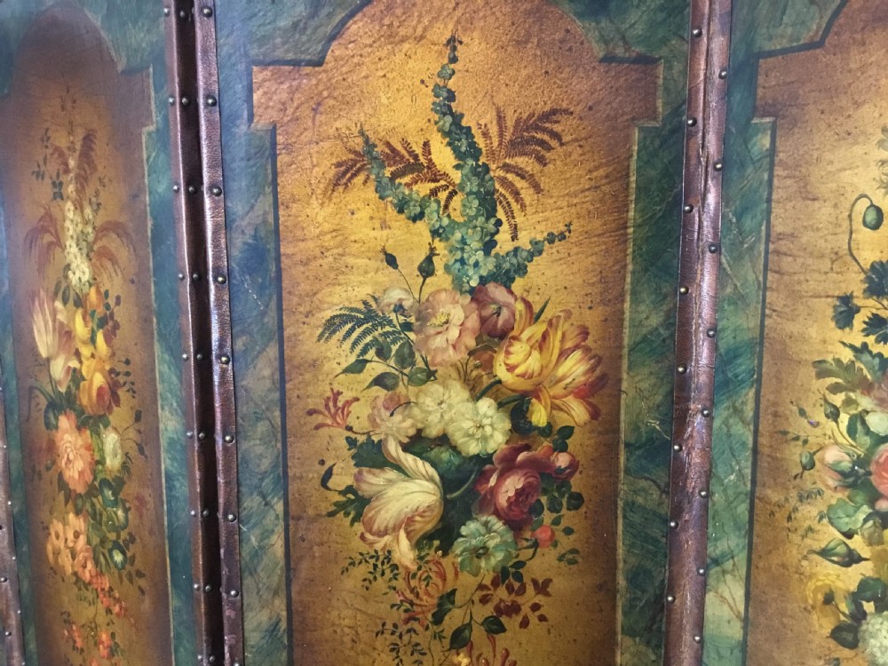 A 19th-century four-fold leather room divider screen featuring painted floral panels framed in faux-marble green borders with brass stud detailing. View XVI