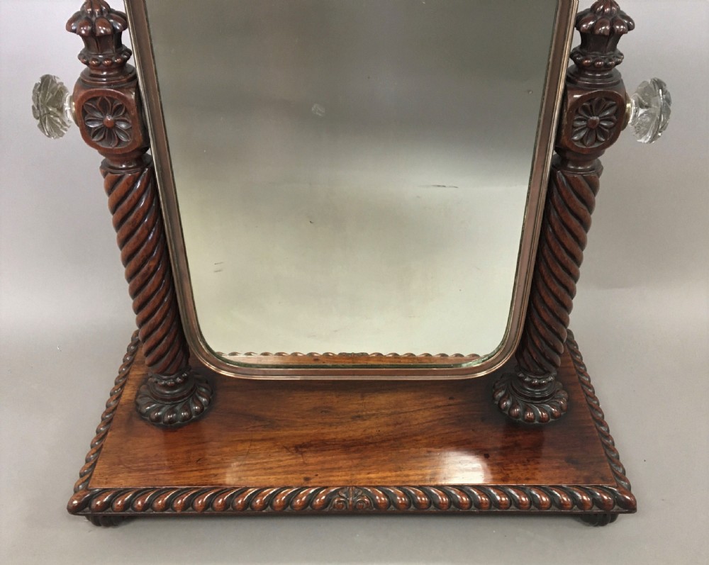 An antique Regency Anglo-Indian dark padouk timber dressing mirror featuring spiral twist columns, carved rope-twist base trim, glass side knobs, and a tall rectangular mirror plate. View IV