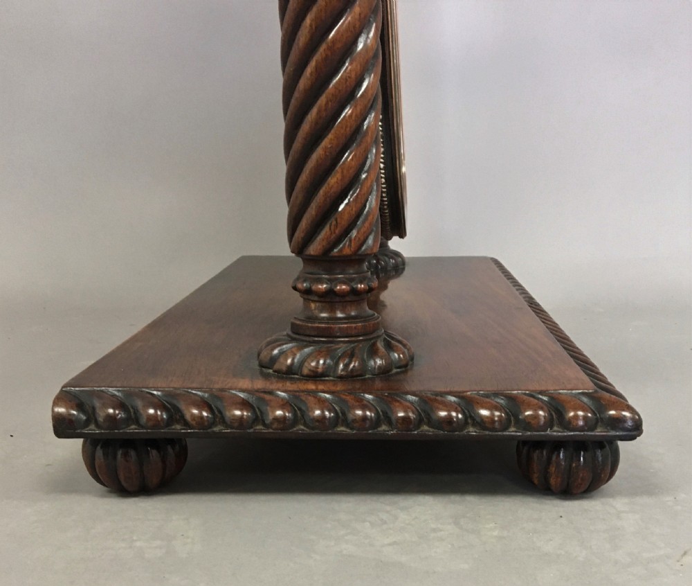 An antique Regency Anglo-Indian dark padouk timber dressing mirror featuring spiral twist columns, carved rope-twist base trim, glass side knobs, and a tall rectangular mirror plate. View XVII