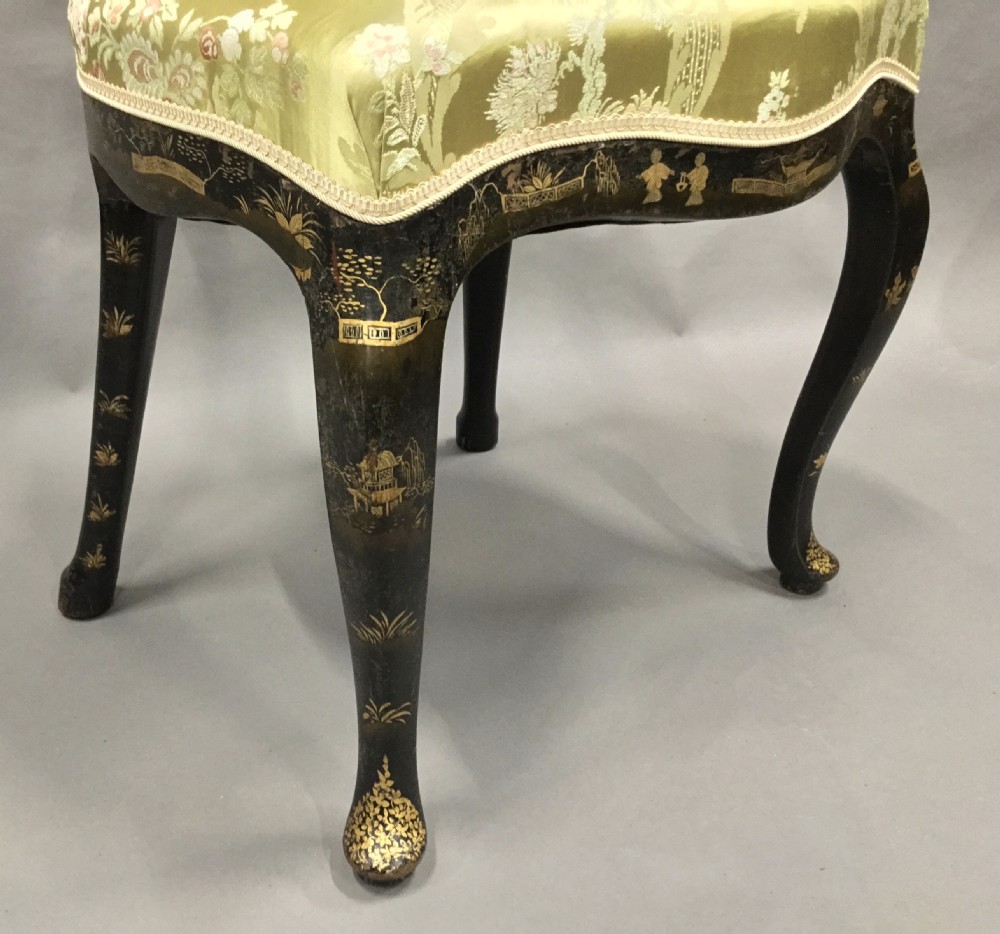 A pair of 18th-century Dutch black lacquered side chairs featuring gold chinoiserie motifs, shaped splat backs, cabriole legs, and green patterned silk seats. View XIII