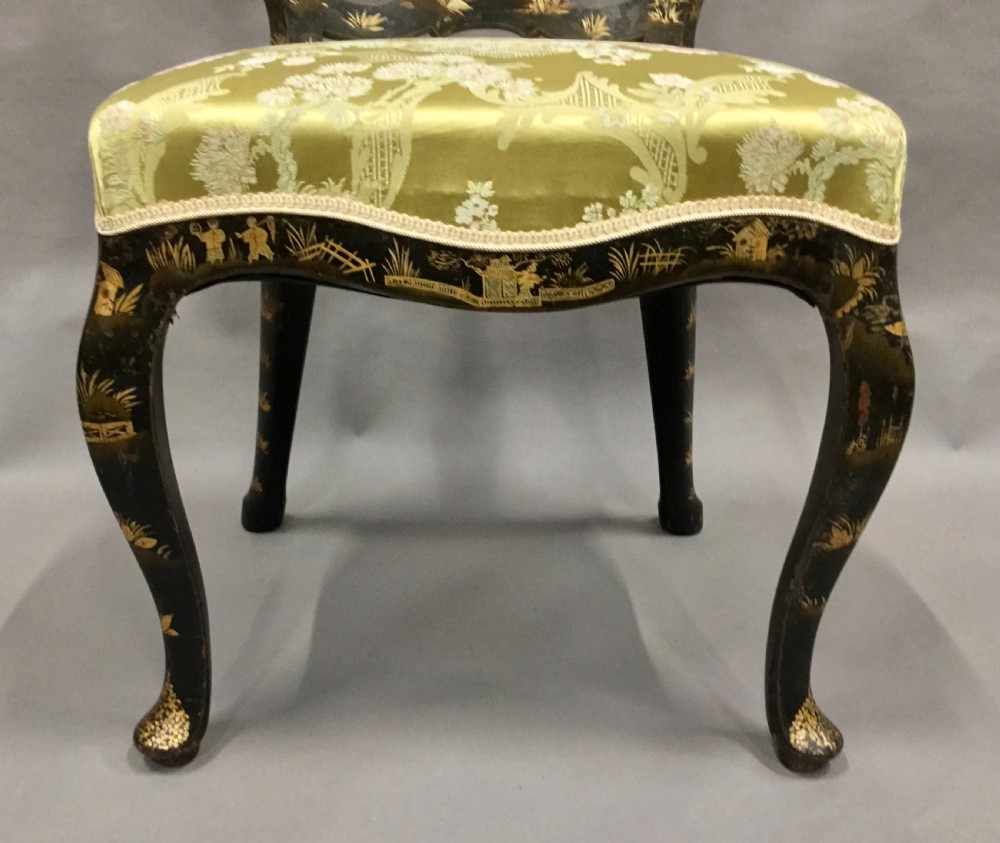 A pair of 18th-century Dutch black lacquered side chairs featuring gold chinoiserie motifs, shaped splat backs, cabriole legs, and green patterned silk seats. View XV