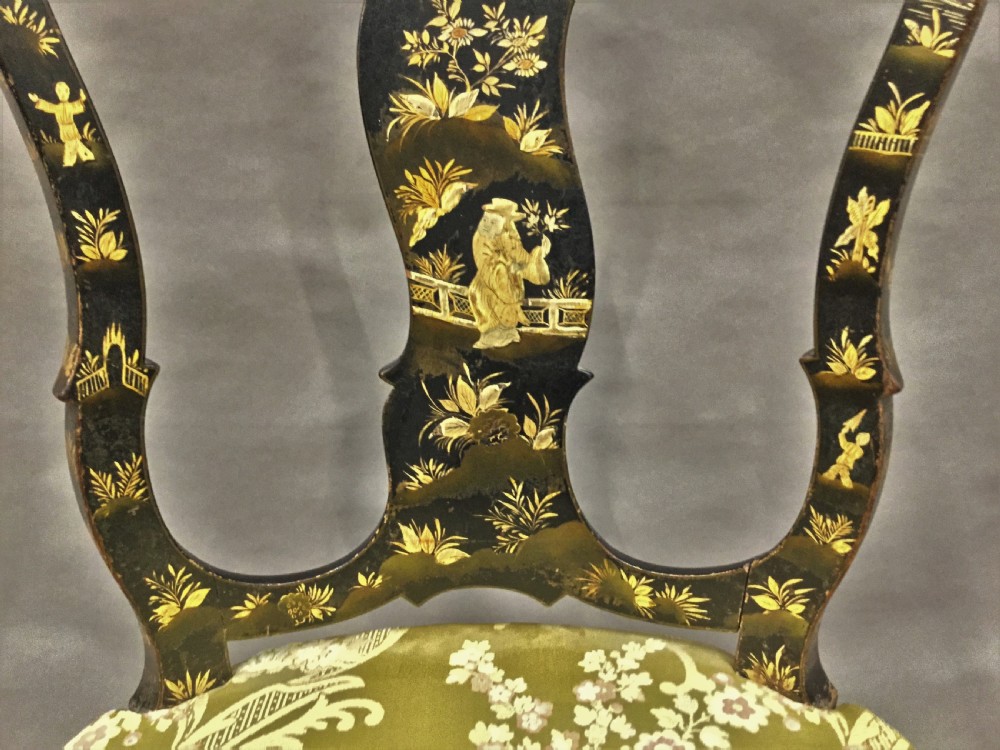 A pair of 18th-century Dutch black lacquered side chairs featuring gold chinoiserie motifs, shaped splat backs, cabriole legs, and green patterned silk seats. View XVI