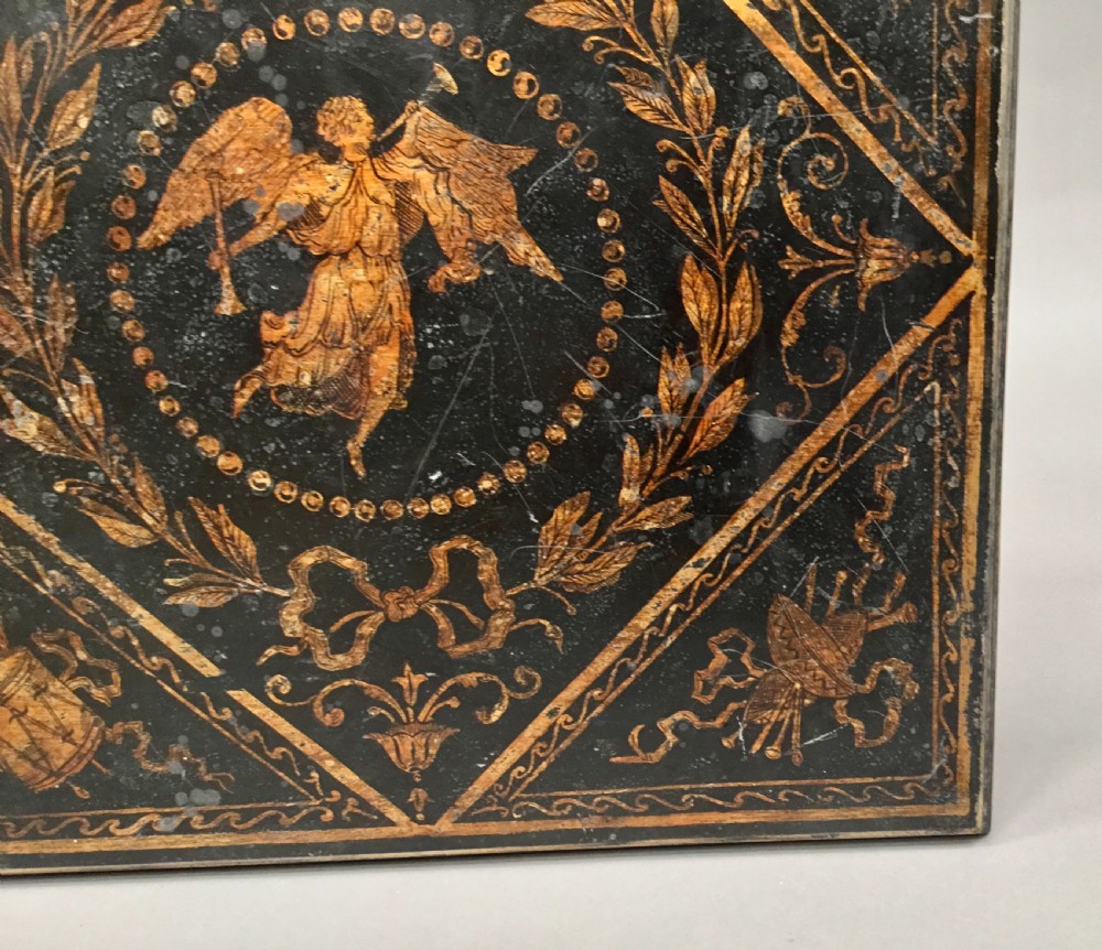 A square-topped Regency neoclassical painted pedestal occasional table with central winged figure motif and turned column on a plinth base. View VII