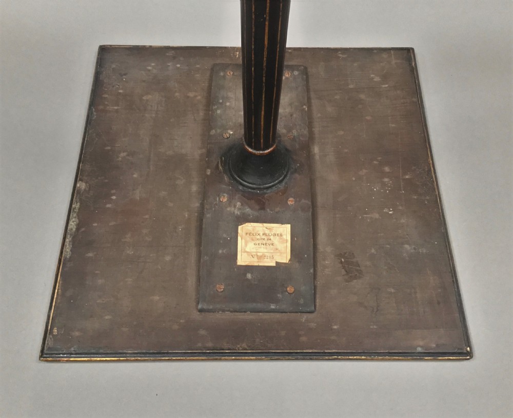 A square-topped Regency neoclassical painted pedestal occasional table with central winged figure motif and turned column on a plinth base. View IX
