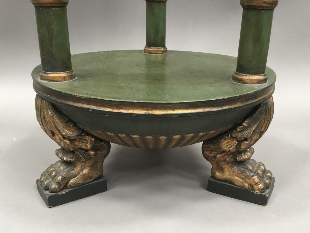 A pair of tall 19th-century Swedish neoclassical stands painted green with gilded accents, circular tops, lower shelves, and turned columns raised on carved lion paw feet. View VIII