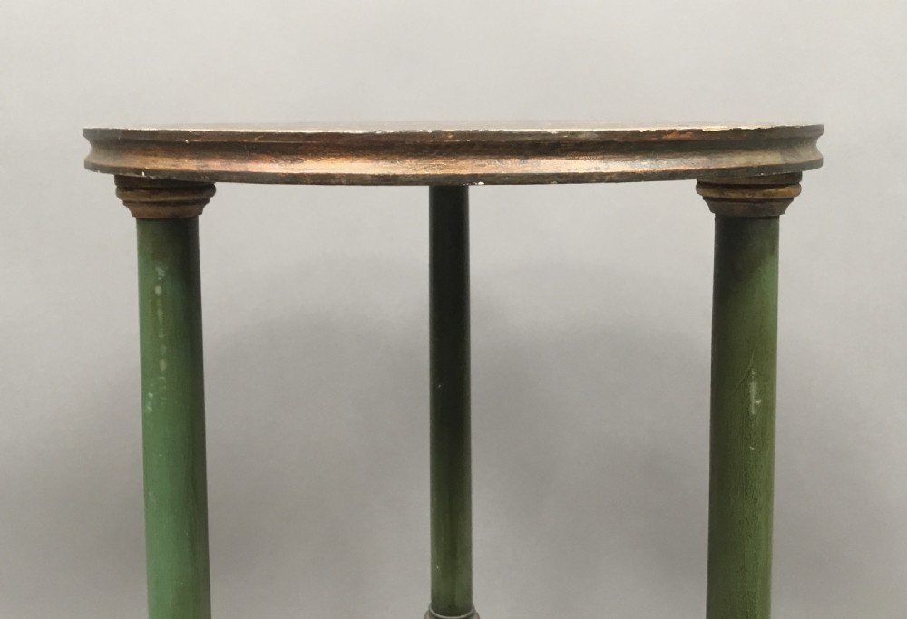 A pair of tall 19th-century Swedish neoclassical stands painted green with gilded accents, circular tops, lower shelves, and turned columns raised on carved lion paw feet. View IX