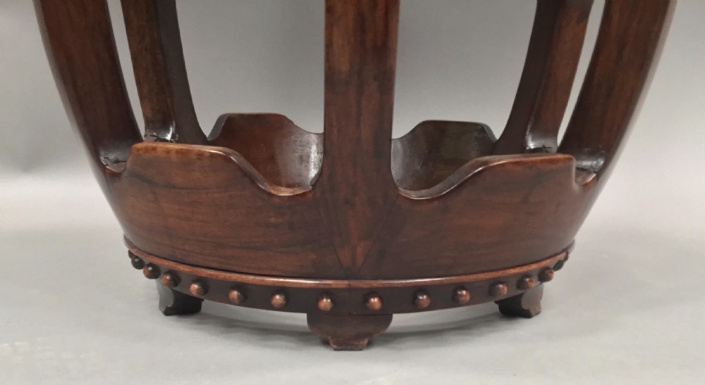 A 19th-century Chinese Hongmu hardwood barrel-form stool featuring a round white marble inset top and carved openwork sides adorned with raised studs. View X