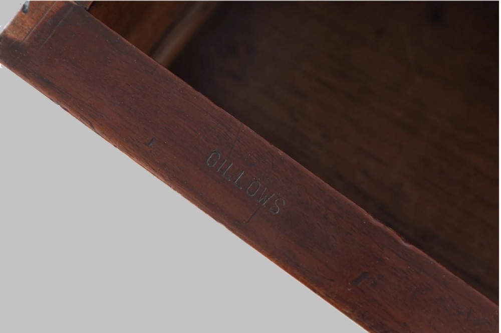 A Late Regency mahogany console table featuring a raised gallery back, carved acanthus leaf scroll legs, and rosette corner blocks. View VI