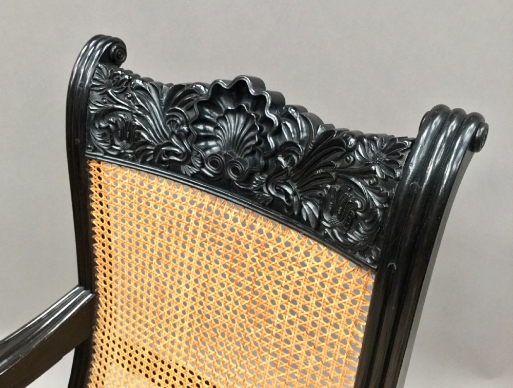 C19th Indian carved ebony open arm library chair; finely carved in solid ebony.  Galle District, Ceylon View VII