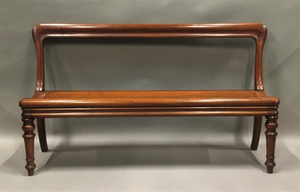 George IV mahogany hall bench / hall seat; of an unusual sculptural design View II