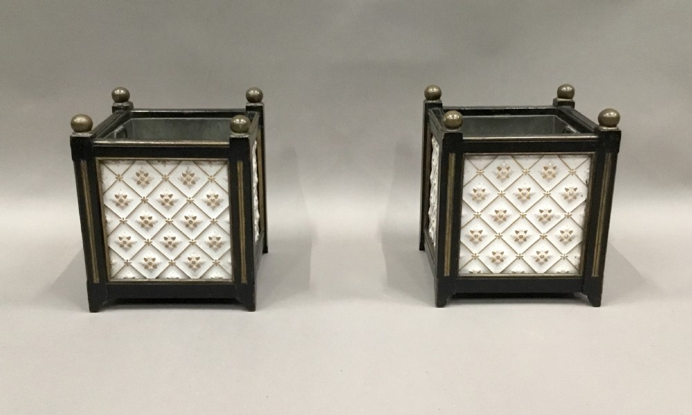 A pair of 19th-century square ebonised wood jardinieres featuring cream ceramic Minton tiles with raised star motifs, brass ball finials, and internal metal liners. View III