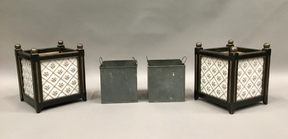 A pair of 19th-century square ebonised wood jardinieres featuring cream ceramic Minton tiles with raised star motifs, brass ball finials, and internal metal liners. View IV