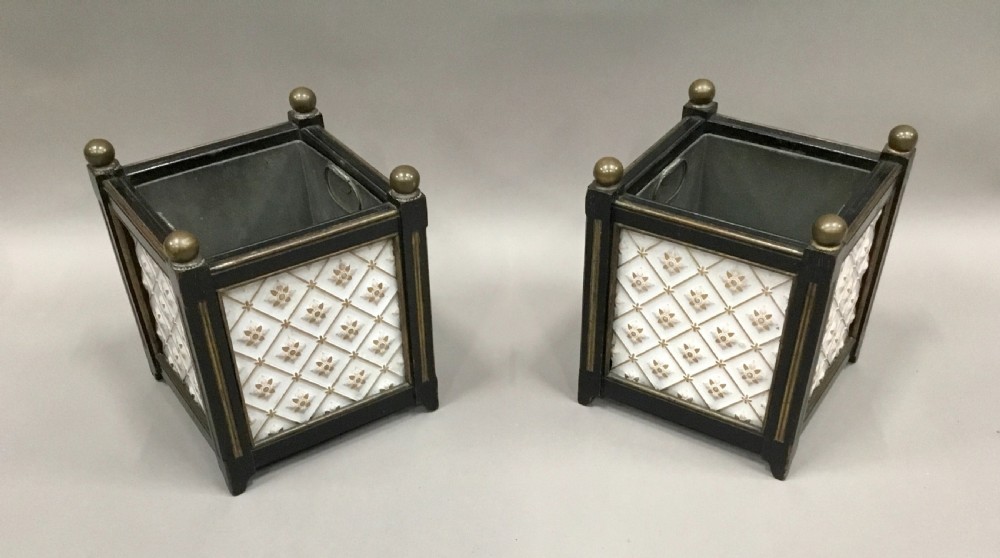 A pair of 19th-century square ebonised wood jardinieres featuring cream ceramic Minton tiles with raised star motifs, brass ball finials, and internal metal liners. View X