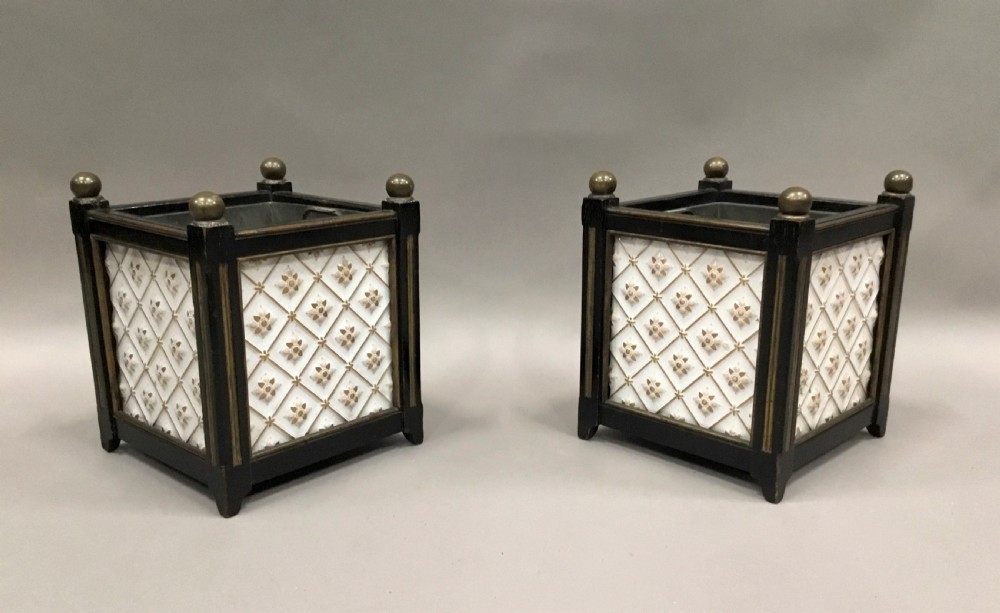 A pair of 19th-century square ebonised wood jardinieres featuring cream ceramic Minton tiles with raised star motifs, brass ball finials, and internal metal liners. View XII